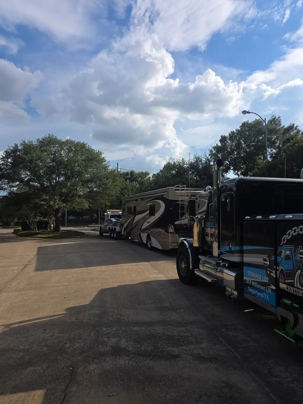 Motorhome hooked to the rotator underlift on a neighborhood street